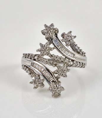 Lot 185 - A 9ct white gold and diamond 'shooting star'...