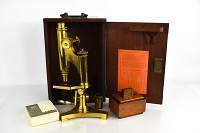 Lot 4 - An R&J Beck brass monocular microscope in...