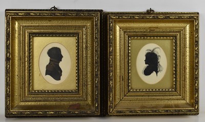Lot 553 - A pair of hand painted silhouette portrait...