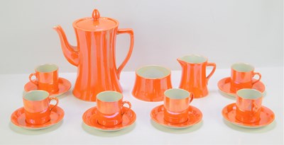 Lot 28 - A Carlton Ware orange lustre coffee set.