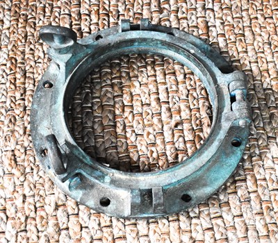 Lot 26 - A bronze ships porthole cover.