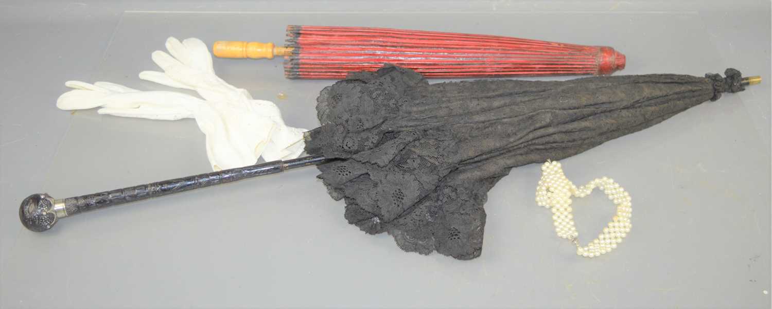 Lot 27 - A French lace parasol with silver and carved...