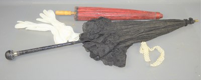 Lot 27 - A French lace parasol with silver and carved...