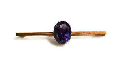 Lot 30 - A rose gold (untested) and amethyst set brooch...