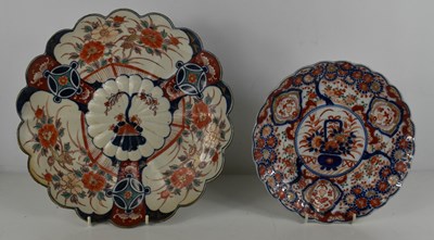 Lot 275 - A 19th century Imari dish, with scalloped edge,...