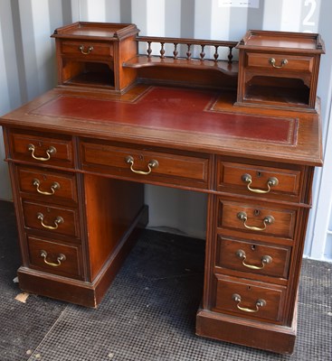 Lot 255 - An Edwardian mahogany desk, with raised back...