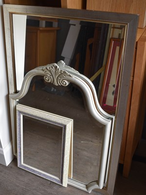 Lot 244 - Four modern wall mirrors to include a silvered...