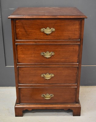 Lot 229 - A mahogany chest of four short drawers, with...