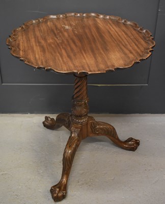 Lot 267 - A 19th century tripod table with pie crust top,...