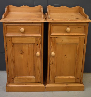 Lot 235 - A pair of pine bedside cabinets, with single...