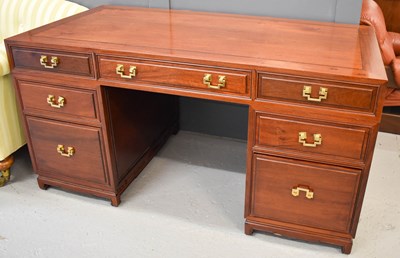 Lot 260 - A modern hardwood Chinese partners / pedestal...