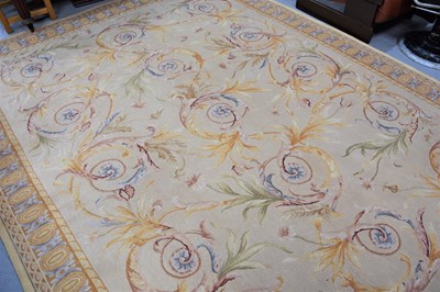 Lot 265 - A large modern rug in the French style, with...