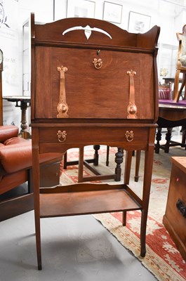 Lot 132 - An Arts & Crafts Liberty style slim fall front...