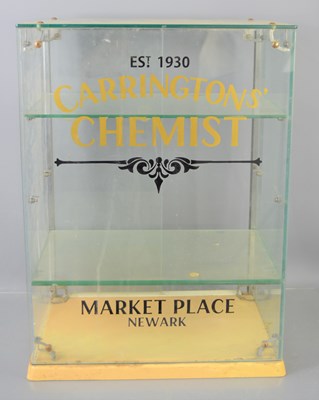 Lot 123 - A glass counter top shop cabinet, bearing...