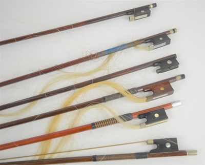 Lot 395 - A group of 19th century and later violin bows...