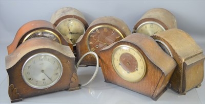 Lot 103 - A group of seven oak and mahogany mantle...