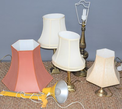 Lot 440 - Four brass table lamps with shades of various...