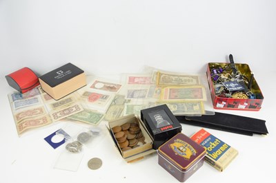 Lot 384 - A group of worldwide banknotes and coinage...