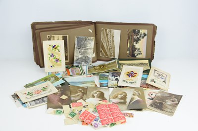 Lot 230 - An album of Edwardian and later postcards...