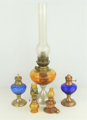 Lot 289 - Four miniature paraffin lamps together with a...