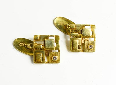 Lot 13 - A pair of yellow metal and diamond designer...