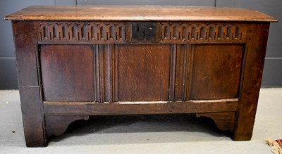 Lot 501 - An 18th century oak coffer, with nulled frieze...