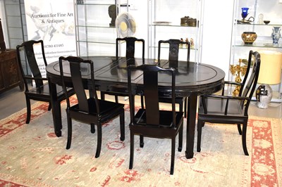 Lot 464 - A Chinese black lacquered dining table with...
