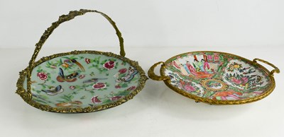 Lot 274 - A Chinese canton dish in a brass basket form...