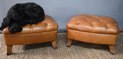 Lot 465 - A pair of Tetrad tan leather footstools, with...