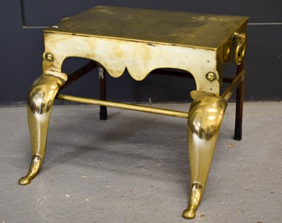 Lot 218 - A Victorian brass footman, with shaped front...