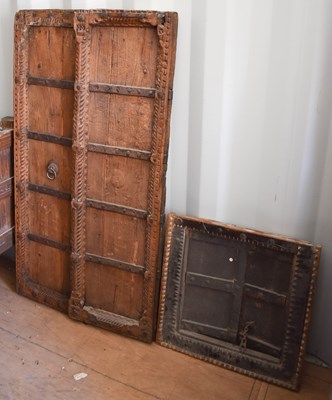 Lot 495 - A wooden carved pair of window shutters,...