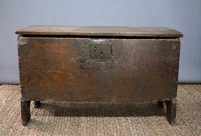 Lot 494 - A 17th century boarded oak coffer, with V cut...