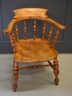 Lot 478 - A 19th century smokers bow armchair, with...