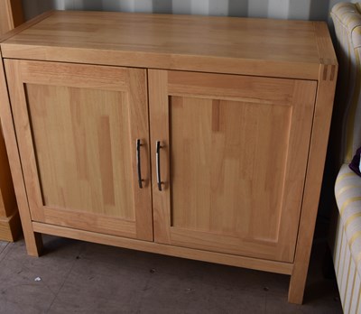 Lot 468 - A beech cabinet with two panelled doors, 85cm...