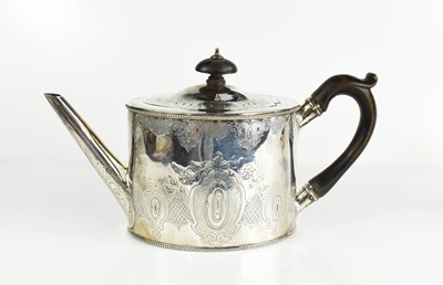 Lot 135 - A silver Edwardian tea pot, engraved with...
