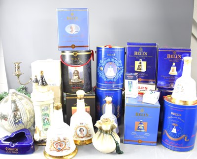 Lot 105 - A group of Bells and similiar whisky decanters,...