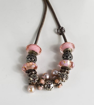 Lot 129 - A Pandora white metal necklace with thirteen...