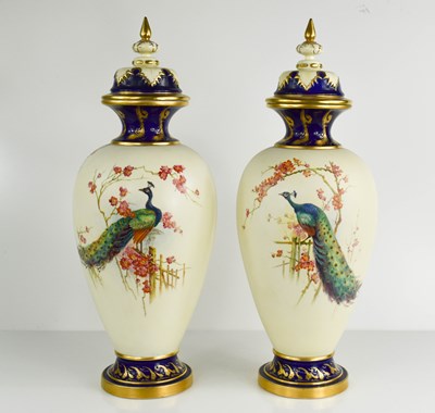 Lot 500 - A pair of Royal Worcester vase and covers,...
