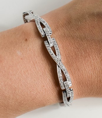 Lot 173 - An 18ct white gold and diamond bracelet, 22.6g.