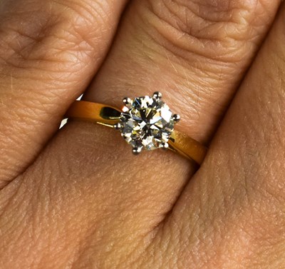 Lot 118 - An 18ct yellow gold, platinum and six claw...