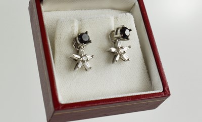 Lot 157 - A 14ct white gold and black diamond stud...