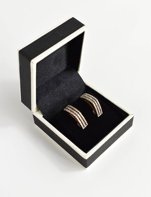 Lot 170 - An 18ct yellow and white gold three row...