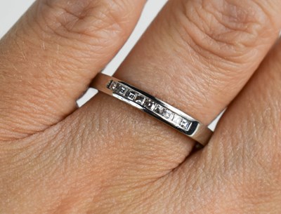 Lot 150 - A platinum and diamond eternity ring, composed...