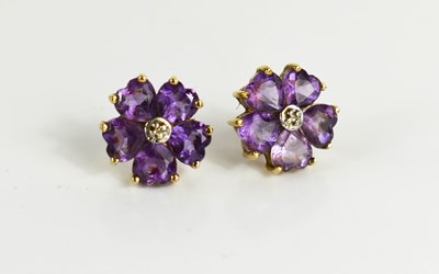 Lot 104 - A 9ct gold and amethyst flowerhead stud...