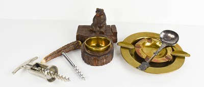 Lot 141 - A Black Forest carved wooden bear ashtray...