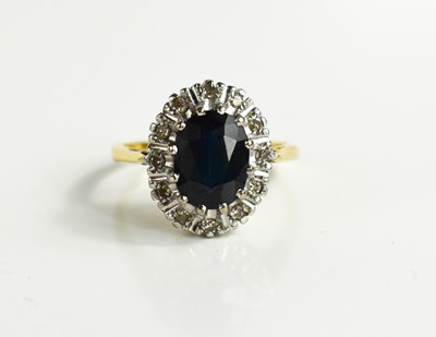 Lot 20 - A gold (tests as 18ct) sapphire and diamond...