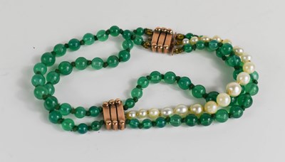 Lot 82 - An Art Deco 9ct gold, pearl and green stone...