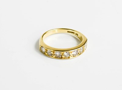 Lot 153 - An 18ct gold and diamond seven stone ring.