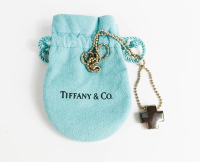 Lot 57 - A Tiffany silver cross and chain, complete...