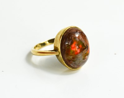 Lot 12 - A 9ct gold and fire opal ring, size O, 4.2g.